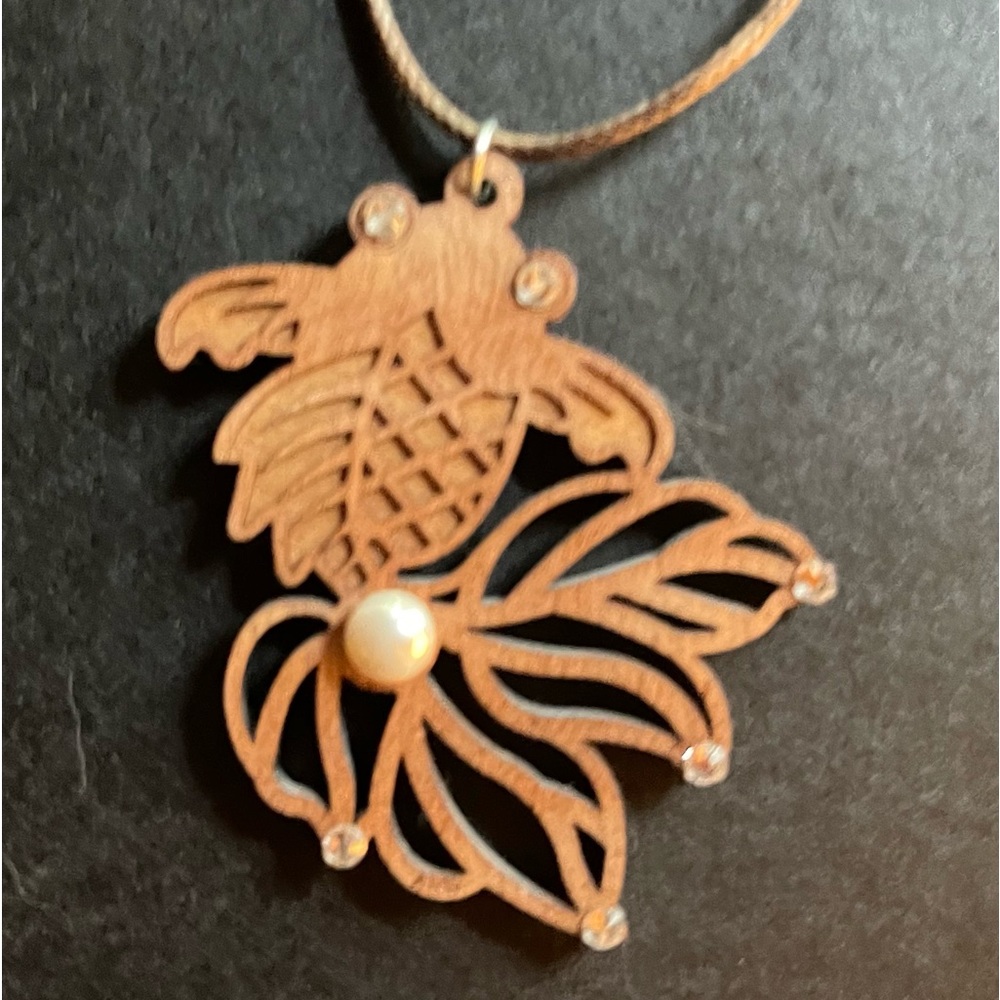 Delicate handmade, pendent made of wood, pearl, crystals, leather strap